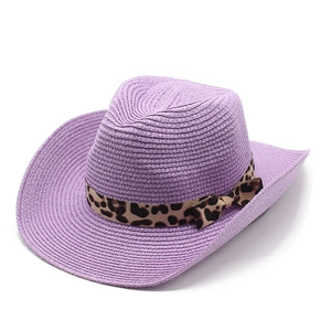 Detail of purple straw cowboy hat with leopard print ribbon and bow decoration