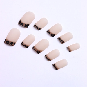 Matte nude pink press-on nails with dark leopard print French tips in square shape