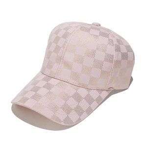 Detailed view of pink curved brim baseball cap with metallic gold checkerboard pattern