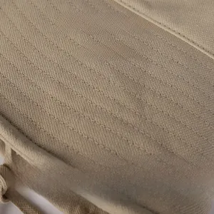 Close-up of khaki wide brim sun hat showing detailed topstitching and premium cotton fabric