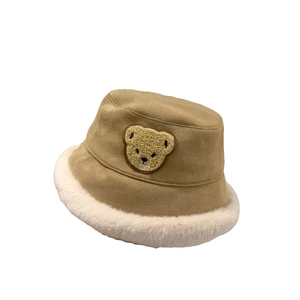 Beige plush fisherman hat for toddlers featuring cute bear embroidery and white brim