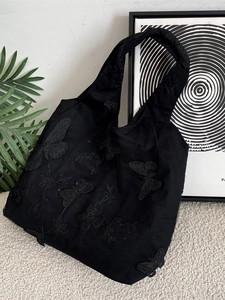 Black mesh tote bag featuring exquisite butterfly embroidery and a large capacity design