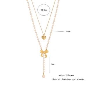 Detailed size specifications for the gold layered necklace with heart and bow accents