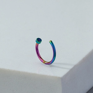 Rainbow gradient horseshoe nose ring clip on a geometric stand, hip hop style jewelry