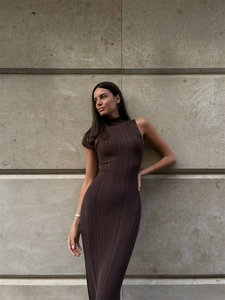 Detail of elegant dark brown ribbed knit maxi dress with a sophisticated turtleneck design