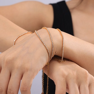 Elegant gold plated tennis bracelet with zircon stones on female wrist model view