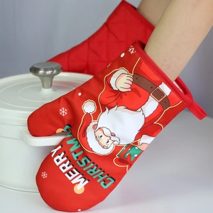 Christmas oven mitt detail showing Santa Claus print and heat resistant fabric texture.