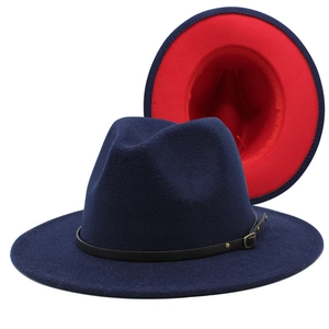 Detail of navy wool fedora showing bright red interior contrast and leather belt buckle