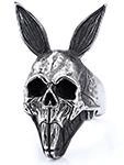 Detail shot of vintage gothic skull rabbit ring in retro silver finish and punk style