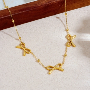 Elegant gold-plated bow pendant necklace with smooth bead chain links for women