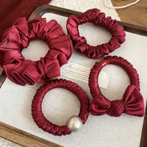 Elegant wine red 4-piece hair scrunchie set with satin finish and faux pearl detail