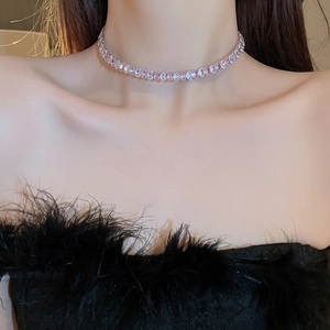 Elegant choker necklace with alternating pink and white zircons worn by a model