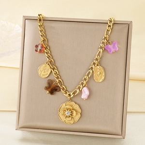 Detailed view of Cuban chain necklace with lion pendant and colorful acrylic butterfly charms
