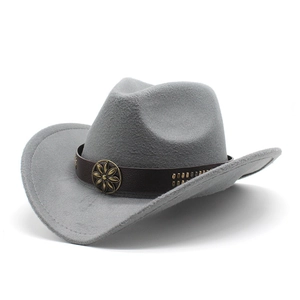 Close-up of light gray felt cowboy hat with leather band and bronze floral buckle