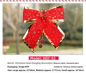 Detailed view of red velvet Christmas bows with gold edges and festive pinecone accents
