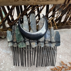 Macro detail of natural blue crystal hair comb with black moon and wire-wrapped finish