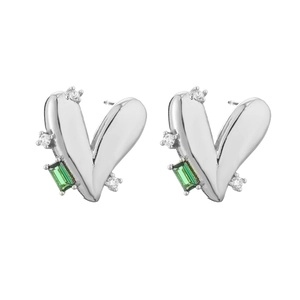 Detail view of silver heart earrings with white zircons and green rectangular gemstones