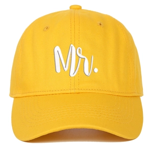 Detail of yellow cotton baseball cap with white Mr. embroidery and stitched eyelets