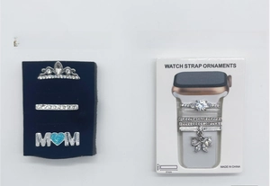Detail of silver decorative charms with MOM heart and crystals for Apple watch silicone bands