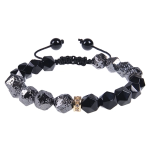Detail of 10mm faceted turquoise and obsidian beads on adjustable braided rope bracelet