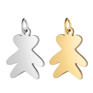 Macro shot of bear-shaped stainless steel pendants in polished silver and gold finishes