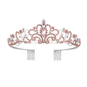 Close-up of silver crystal crown featuring pink teardrop stone and dual side combs