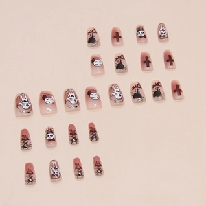 Pink gradient press-on nails set with dark cartoon, cross motifs and Die lettering