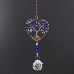 Detail of heart life tree suncatcher with blue stones and crystal prism pendant