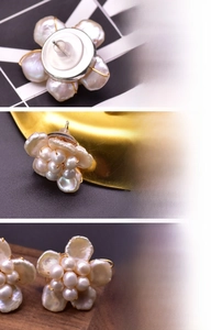 Detailed macro view of baroque flower pearl earrings with 18K gold plated finish