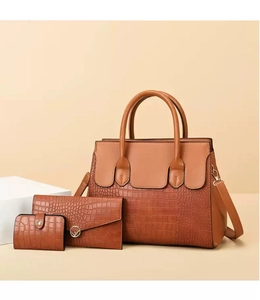 Detailed set of caramel brown vintage tote with embossed crocodile texture and wallets