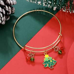 Detailed shot of adjustable Christmas bracelet with green tree charm and red beads