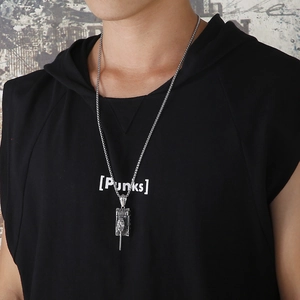 Streetwear style photo of a textured stainless steel tank pendant on a metal chain