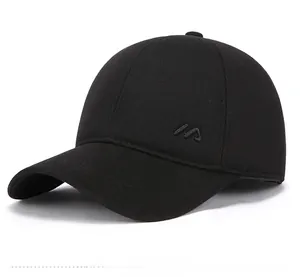Detail of classic black wool baseball cap featuring side embroidery and ear protection