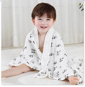 Macro detail of soft 6-layer cotton gauze baby towel with cute panda and bamboo prints