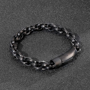 Detail of all-black stainless steel curb chain bracelet with streamlined buckle