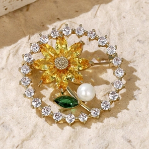 Elegant wheat ear and sunflower brooch with zircons and pearl on textured paper