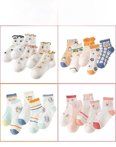 Close-up of breathable mesh summer socks for children featuring cute animal patterns