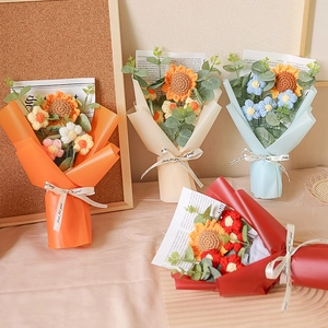 Handmade knitted sunflower and rose bouquet with colorful wrapping for Valentine's Day