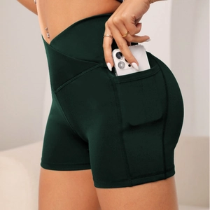 Women's dark green high-waisted yoga shorts with side pocket for workout and fitness