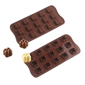 Macro detail of brown silicone bubble chocolate mold with finished candy samples