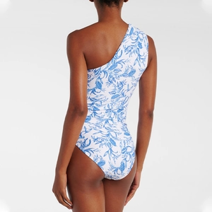 Detail of the back cut and blue floral print on this one-shoulder one-piece swimsuit