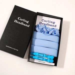 Detailed gift box view of light blue heatless hair curler set with scrunchie and clips