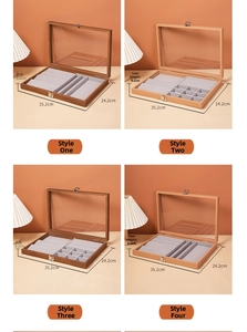 Walnut wood jewelry box with transparent glass lid and vintage metal lock closure