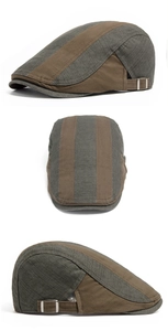 Detail of adjustable metal buckle and striped cotton texture on vintage beret hat
