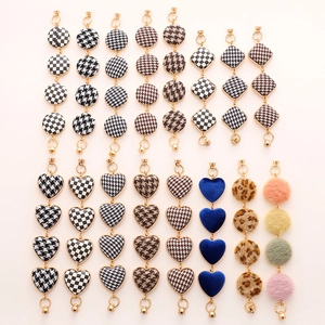 Assorted DIY phone charms featuring checkerboard and houndstooth heart patterns