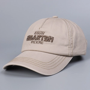 Close-up of beige cotton baseball cap featuring high-density 3D letter embroidery detail