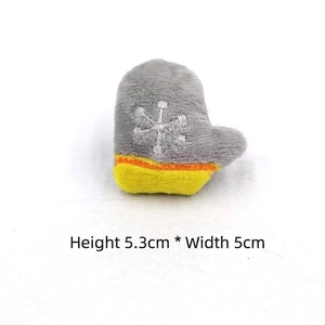 Detail of plush Christmas charm with white snowflake embroidery, size H 5.3cm x W 5cm