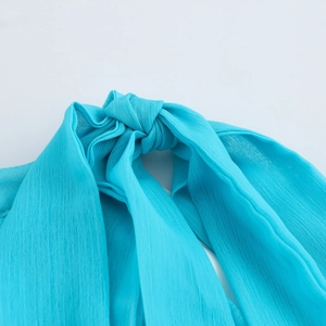 Teal chiffon halter neck maxi dress with elegant tie-up back detail and light texture