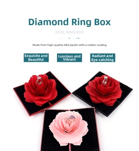 Macro view of diamond-shaped ring box with unfolding rose mechanism and soft rubber finish