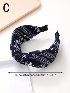 Detail of navy blue paisley headband showing cross knot design and 39cm circumference size